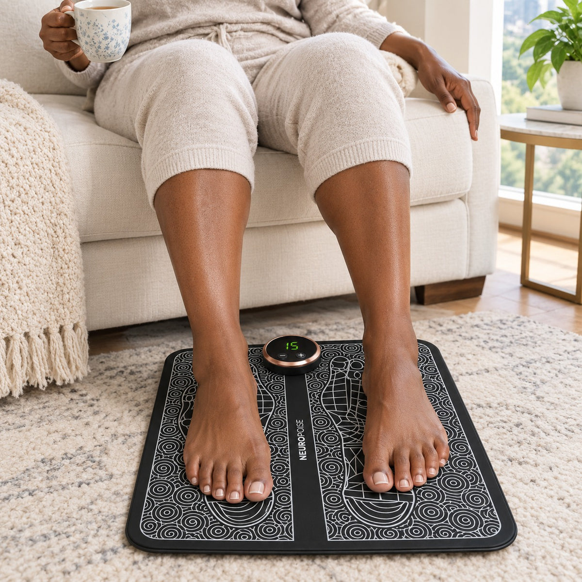 Woman resting her bare feet on the Lymphatic Drainage EMS Foot Plate