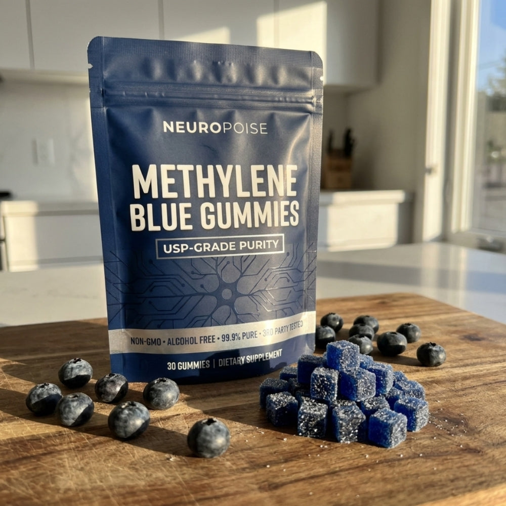A pack of Neuropoise Methylene Blue Gummies on a wooden board with fresh blueberries and a pile of blueberry-flavored gummies.